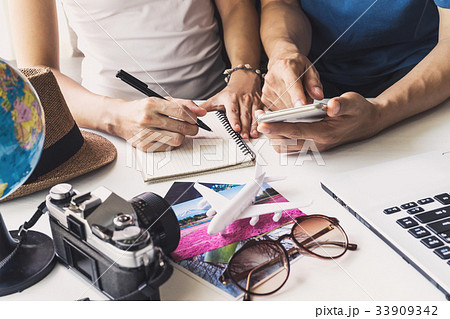 Young couple planning vacation trip 33909342