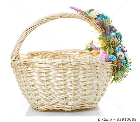 basket decorated with flowers isolated on white 33910088