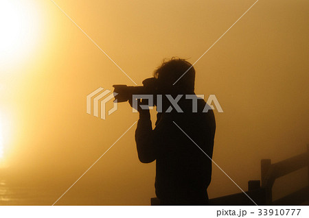 A Photographer's Silhoutte in the morning light A Photographer's Silhoutte in the morning light 33910777