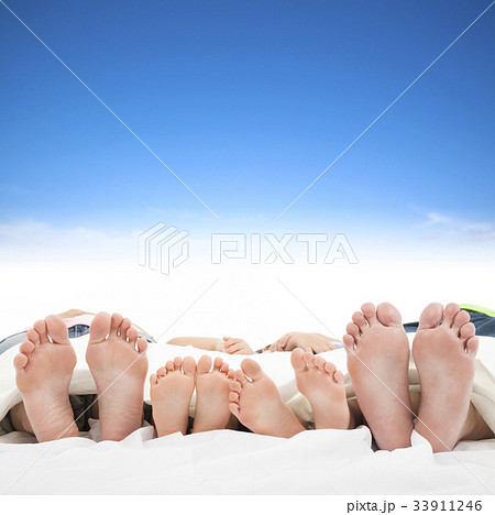 family sleeping on the bed with blue sky family sleeping on the bed with blue sky 33911246