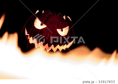 Spooky halloween pumpkin in burning fire flames 33917655