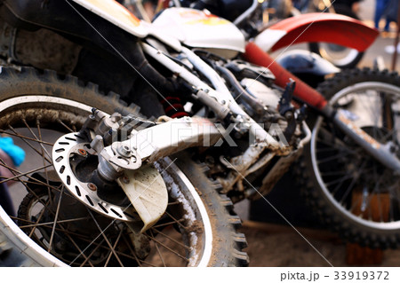 Sports bike with dirty wheels after the competitio 33919372