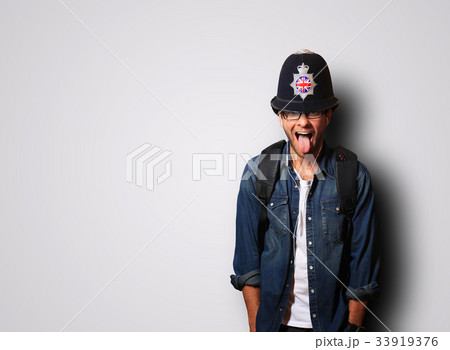 Young man in a helmet of the British policeman  33919376
