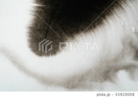 closeup black ink corner spreading on wet paper closeup black ink corner spreading on wet paper 33920008