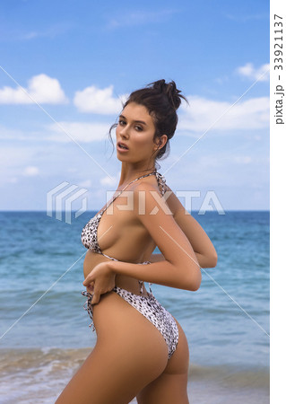 Model girl posing sexy at tropical beach locationの写真素材