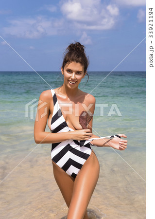 Model girl posing sexy at tropical beach locationの写真素材 [33921194] - PIXTA