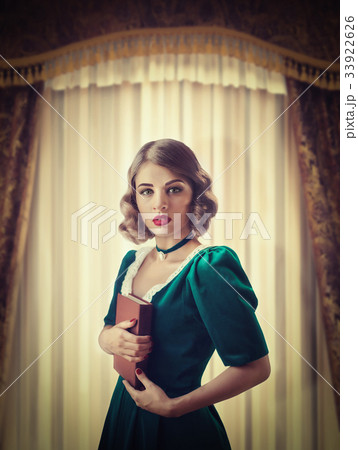 Beautiful woman in retro train, rich interior 33922626