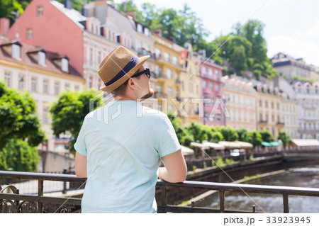 Back view of happy stylish tourist on Czech Back view of happy stylish tourist on Czech 33923945