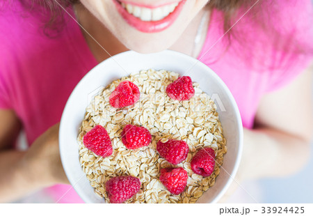 Woman's hands hold healthy and natural breakfast 33924425