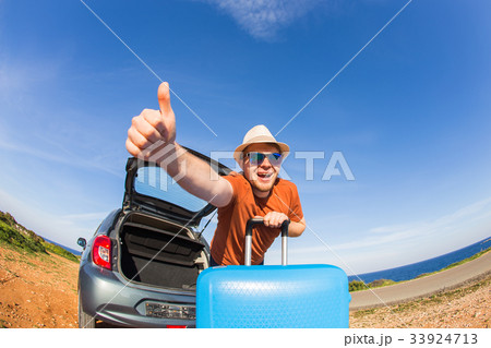 happy man enjoying road trip and summer vacation happy man enjoying road trip and summer vacation 33924713