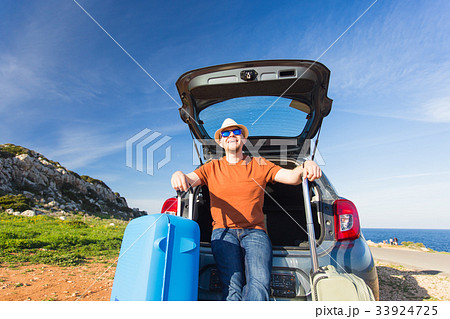Looking at camera, a cheerful man going away for Looking at camera, a cheerful man going away for 33924725