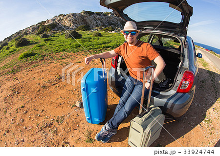Looking at camera, a cheerful man going away for Looking at camera, a cheerful man going away for 33924744