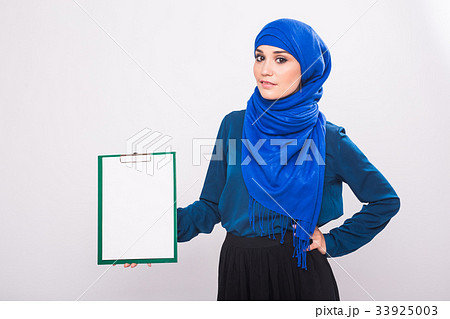 Arabic Muslim beautiful woman holding banner for Arabic Muslim beautiful woman holding banner for 33925003
