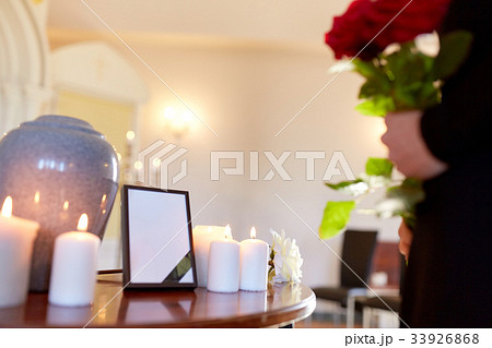cremation urn and woman at funeral in church cremation urn and woman at funeral in church 33926868
