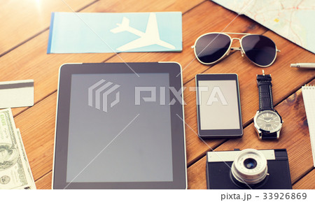 close up of smartphone and travel stuff close up of smartphone and travel stuff 33926869