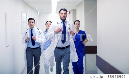 group of medics walking along hospital 33926995