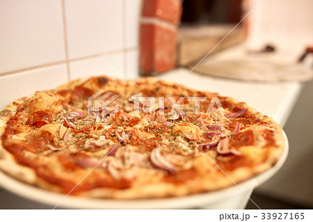 baked pizza at pizzeria baked pizza at pizzeria 33927165