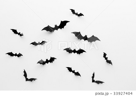 black paper bats over white background black paper bats over white background 33927404