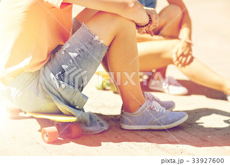 teenage couple with skateboards on city street teenage couple with skateboards on city street 33927600