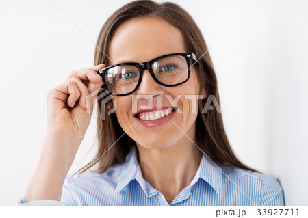 close up of smiling middle aged woman in glasses close up of smiling middle aged woman in glasses 33927711