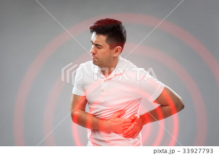 unhappy man suffering from stomach ache 33927793