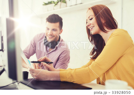 happy creative team with papers at office happy creative team with papers at office 33928050