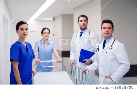 group of doctors with gurney at hospital 33928700