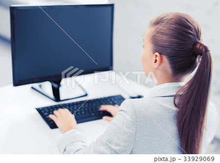 businesswoman with computer in office businesswoman with computer in office 33929069