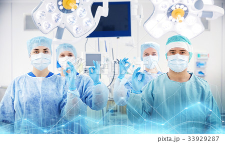 group of surgeons in operating room at hospital group of surgeons in operating room at hospital 33929287