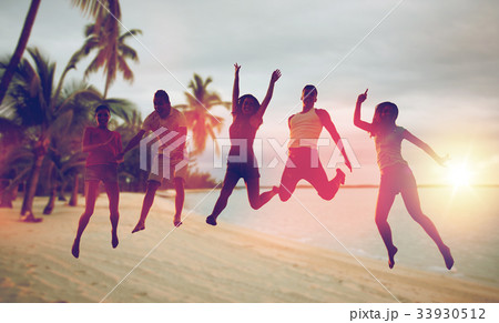 happy friends dancing and jumping on beach happy friends dancing and jumping on beach 33930512