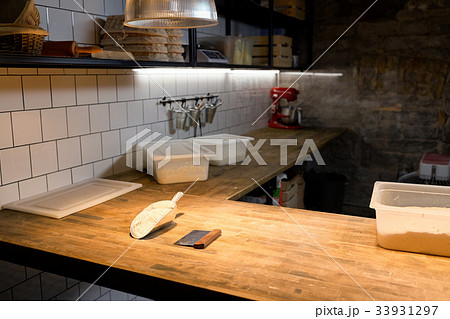 dough and baking tools on bakery kitchen table dough and baking tools on bakery kitchen table 33931297