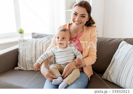 happy young mother with little baby at home 33932021