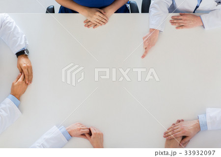 doctor hand showing something imaginary on table doctor hand showing something imaginary on table 33932097