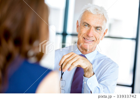 Businessman at the office Businessman at the office 33933742
