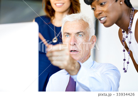 Businesspeople having meeting Businesspeople having meeting 33934426