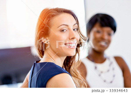Women working together, office interior Women working together, office interior 33934643