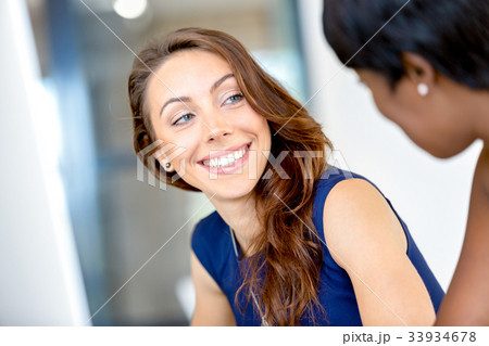 Women working together, office interior 33934678