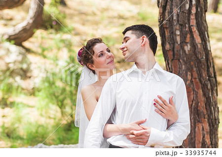 Bride and groom on a romantic moment on nature 33935744