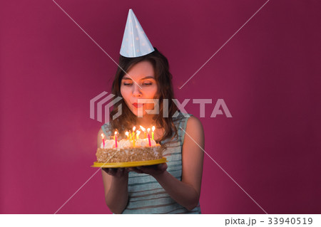 Portrait of pretty girl holding birthday cake and Portrait of pretty girl holding birthday cake and 33940519