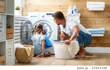 Happy family man father householder and child   in laundry with 33943166