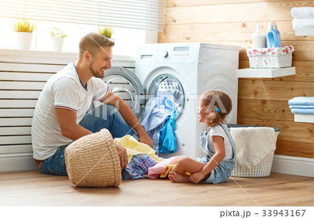 Happy family man father householder and child   in laundry with 33943167