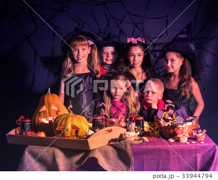 Halloween kids holding carved pumpkin . Halloween kids holding carved pumpkin . 33944794