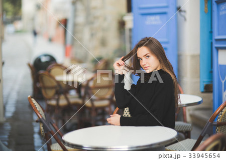 Portrait of a young beautiful woman in a urban Portrait of a young beautiful woman in a urban 33945654
