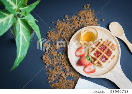 Waffles on the wood plate 33946753