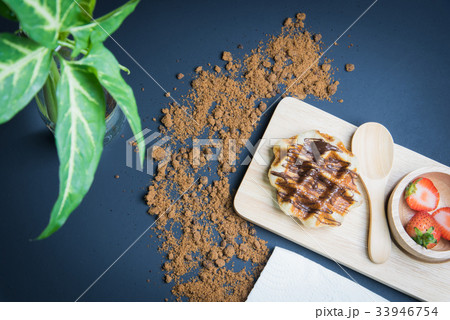 Waffles on the wood plate 33946754