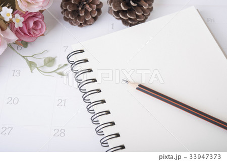 closeup pencil on notebook diary with calendar  33947373