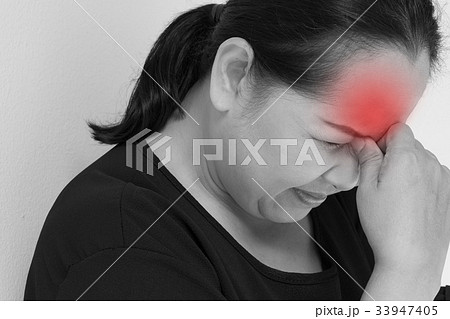 stressed middle aged woman with headache, tension stressed middle aged woman with headache, tension 33947405