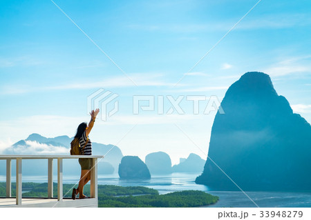 traveler woman backpacker raised arm up to sky traveler woman backpacker raised arm up to sky 33948279