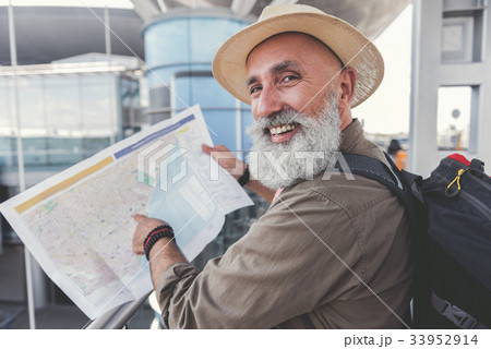 Happy smiling elder man ready for journey Happy smiling elder man ready for journey 33952914
