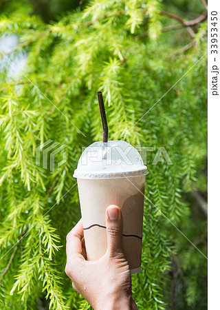 Woman hand is holding an cold coffee cup. Woman hand is holding an cold coffee cup. 33953450